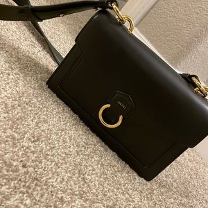 Black JW PEI crossbody/shoulder bag. With gold hardware. Brand new with tags.